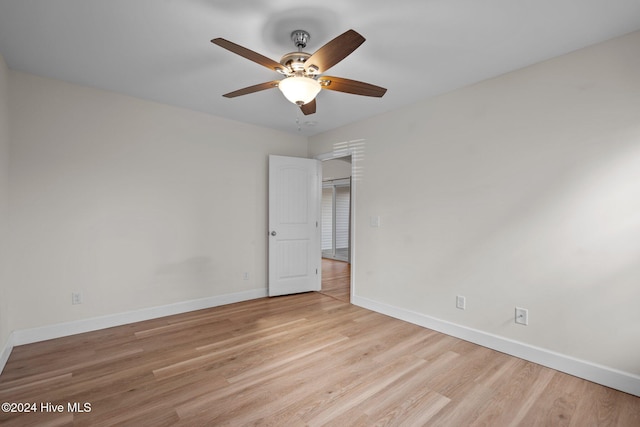 unfurnished bedroom with ceiling fan and light hardwood / wood-style floors