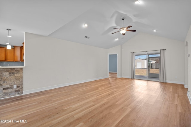 unfurnished living room featuring light wood-type flooring, high vaulted ceiling, and ceiling fan