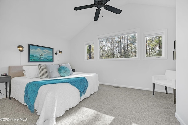 bedroom with ceiling fan, lofted ceiling, light carpet, and multiple windows