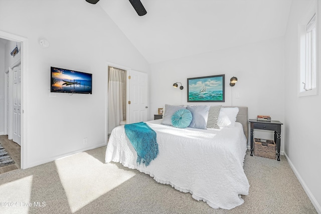 carpeted bedroom featuring ceiling fan and high vaulted ceiling