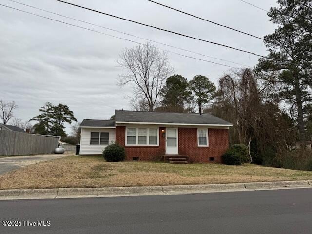single story home with crawl space, driveway, a front yard, and fence