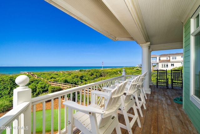 balcony featuring a water view