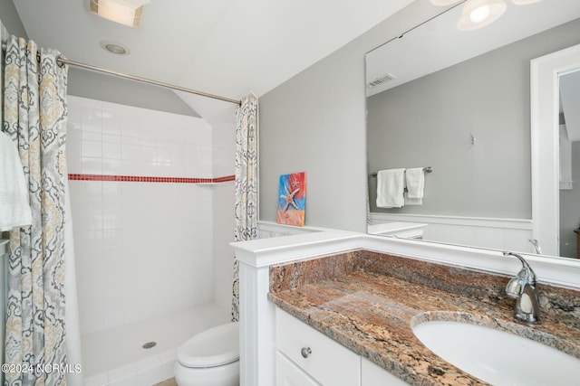 bathroom featuring vanity, toilet, and a shower with shower curtain