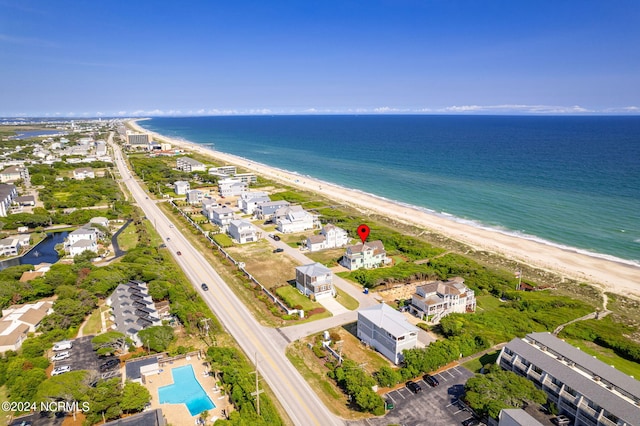 aerial view featuring a water view and a beach view