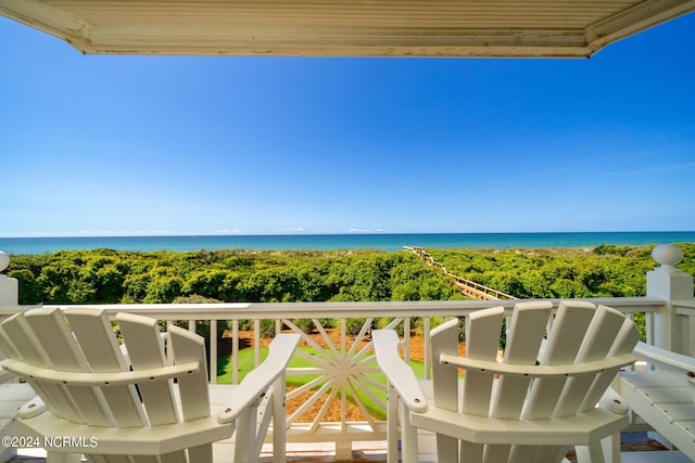 balcony featuring a water view