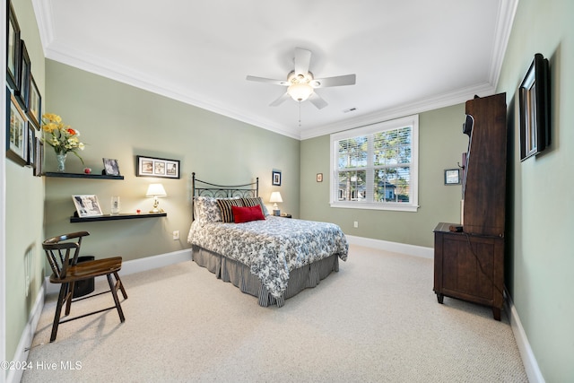 bedroom featuring ceiling fan, crown molding, and carpet