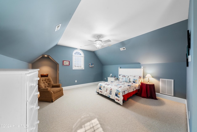 bedroom with carpet flooring, vaulted ceiling, and ceiling fan