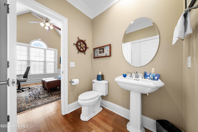 bathroom with ceiling fan, crown molding, hardwood / wood-style floors, toilet, and lofted ceiling