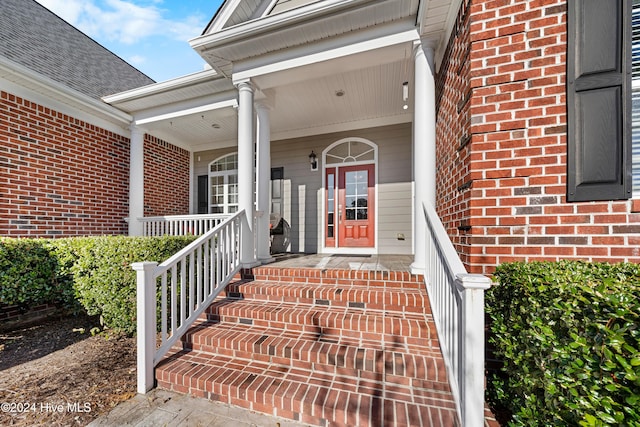 property entrance featuring a porch