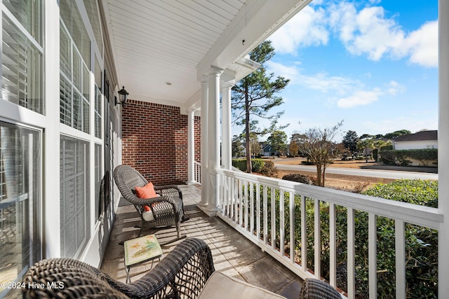 balcony featuring a porch