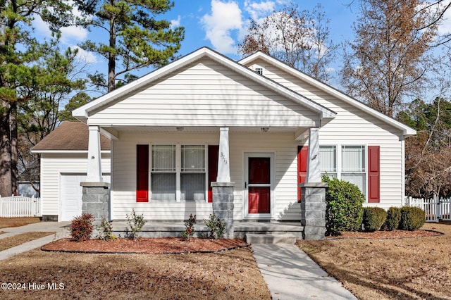 view of front of house with a porch and a garage