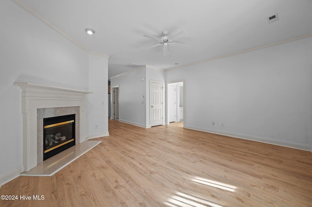 unfurnished living room with light wood-type flooring, ceiling fan, and crown molding