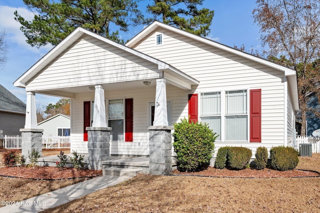 bungalow featuring covered porch and central AC