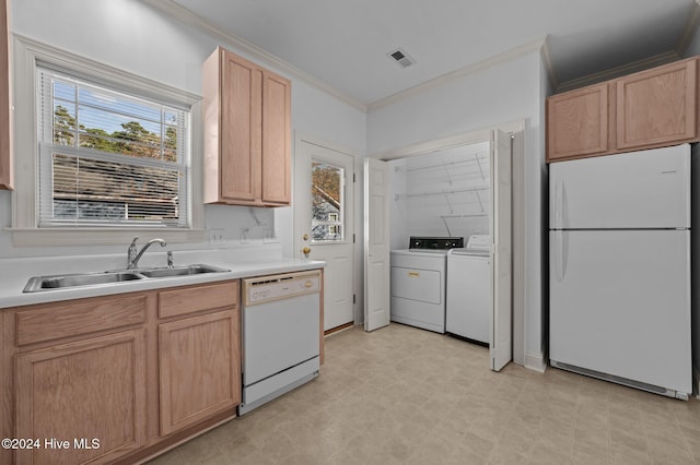 kitchen featuring white appliances, crown molding, sink, light brown cabinets, and independent washer and dryer