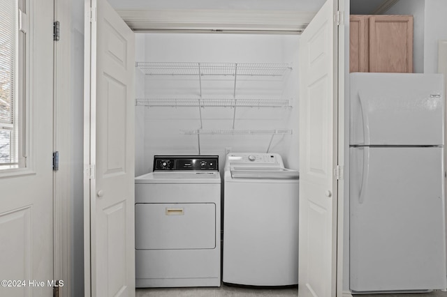 washroom with washer and clothes dryer