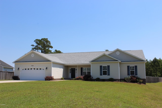 ranch-style home featuring a garage and a front yard