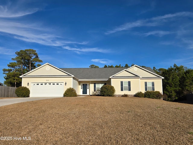 ranch-style home featuring a garage and a front lawn