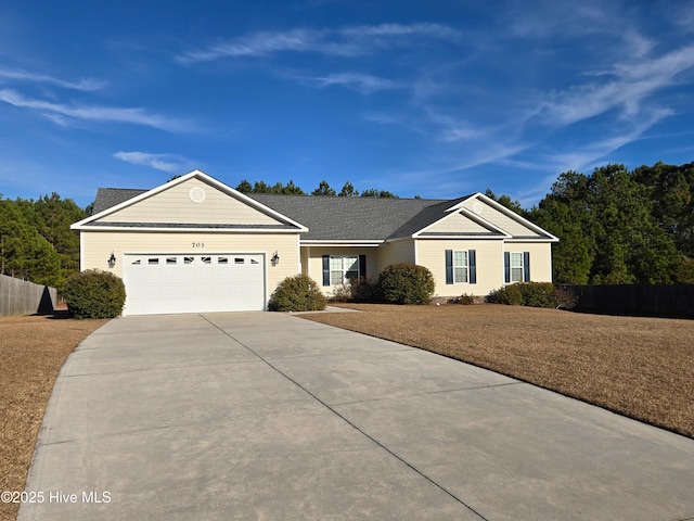 ranch-style house with a garage and a front yard