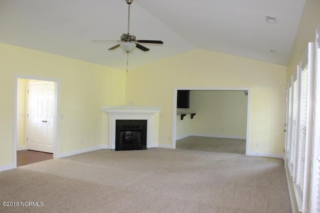 unfurnished living room featuring ceiling fan, light colored carpet, and lofted ceiling