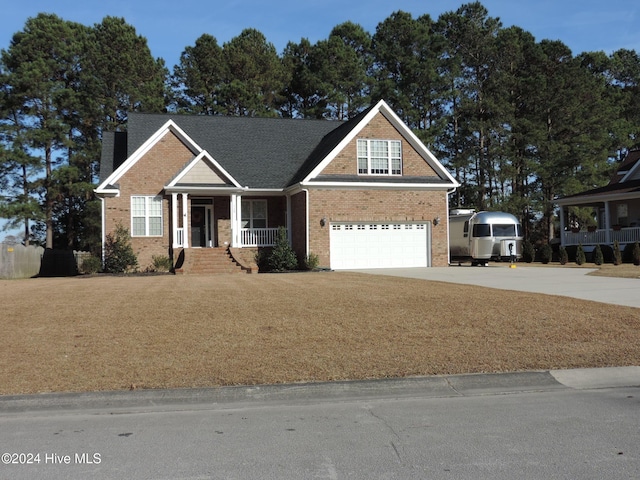 craftsman house featuring a porch and a garage