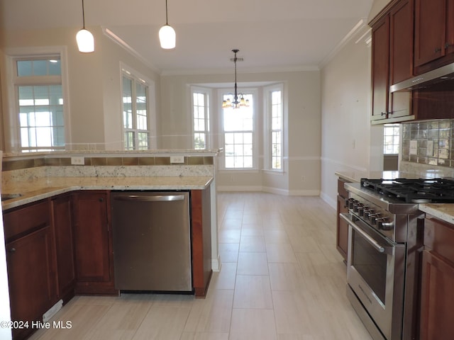 kitchen featuring tasteful backsplash, light stone counters, stainless steel appliances, pendant lighting, and an inviting chandelier