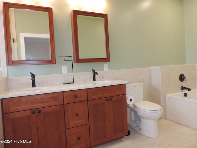 bathroom with vanity, a bath, tile walls, tile patterned flooring, and toilet