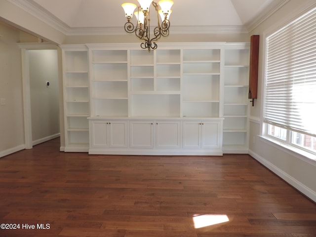 unfurnished dining area featuring an inviting chandelier, crown molding, dark wood-type flooring, and vaulted ceiling