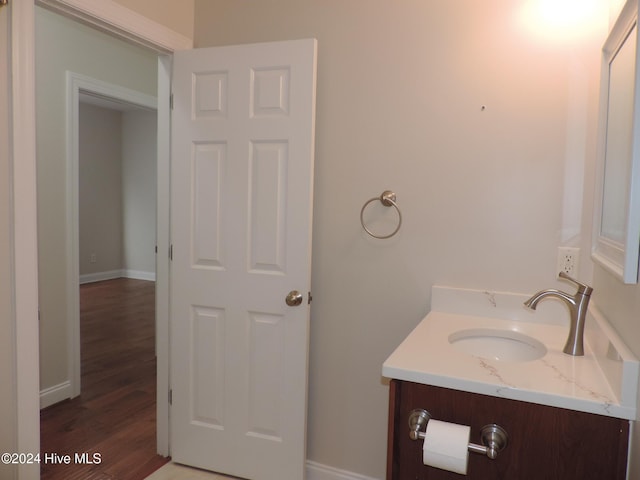 bathroom featuring vanity and hardwood / wood-style flooring