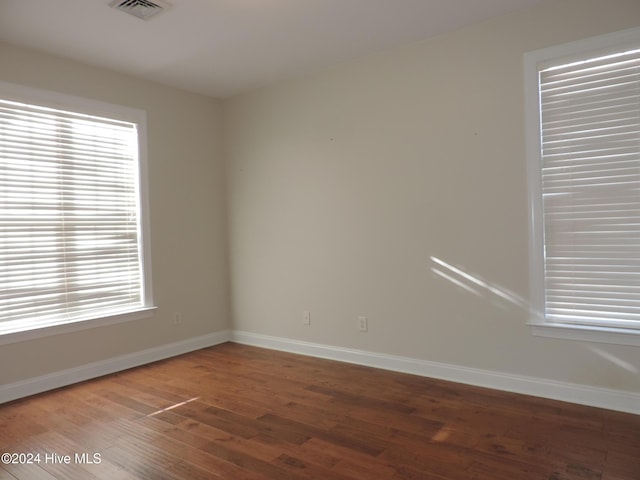 spare room with hardwood / wood-style flooring