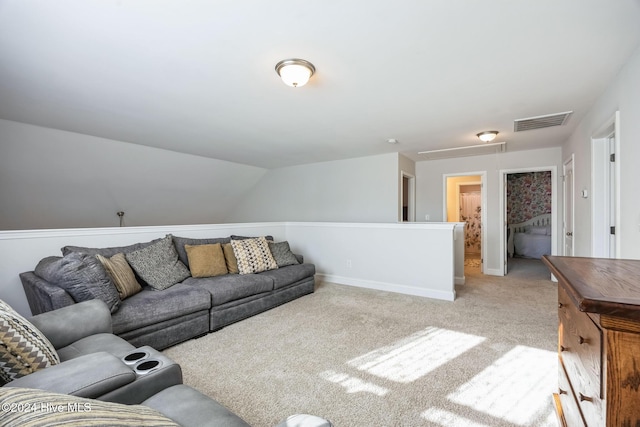 living room featuring light carpet and vaulted ceiling