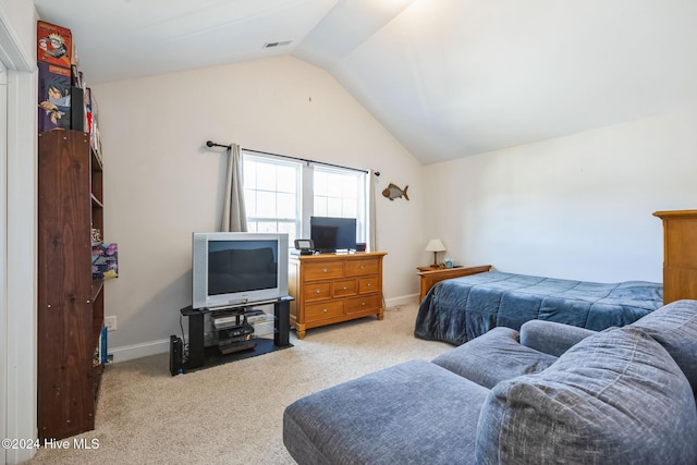 carpeted bedroom featuring vaulted ceiling