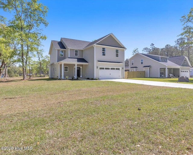 view of front of home with a front lawn, concrete driveway, fence, a garage, and board and batten siding