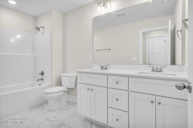 bathroom with marble finish floor, toilet, a sink, and visible vents