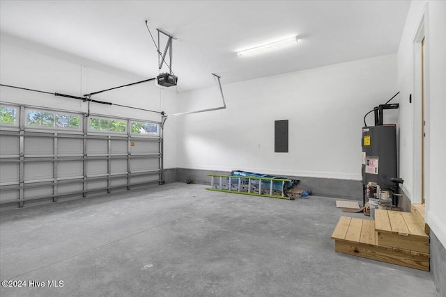 garage featuring electric panel, a garage door opener, and water heater