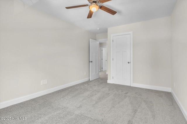 unfurnished bedroom with carpet, baseboards, and ceiling fan