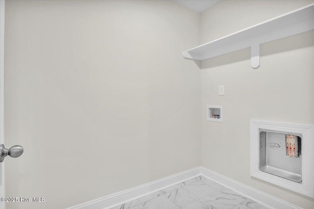 clothes washing area with washer hookup, marble finish floor, baseboards, and laundry area
