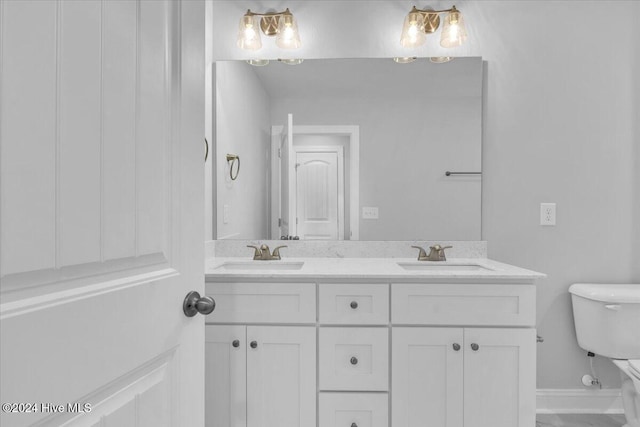 bathroom with vanity and toilet