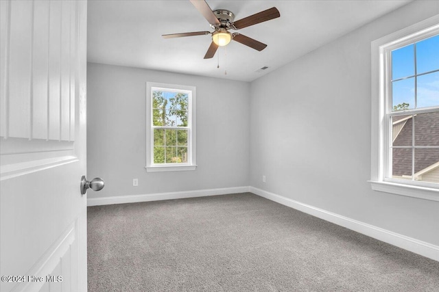 unfurnished room featuring carpet flooring and ceiling fan