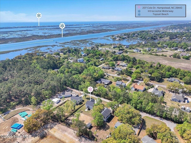 bird's eye view with a residential view and a water view
