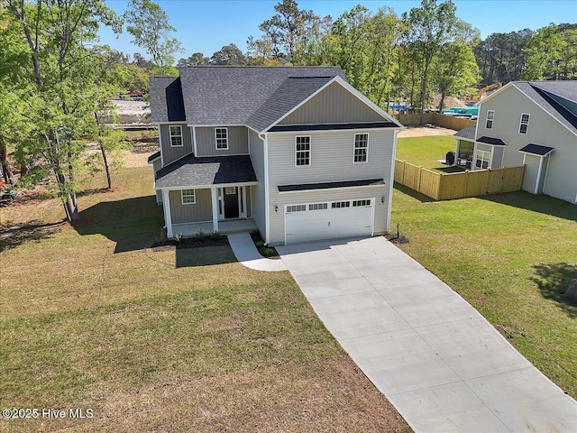 traditional-style home featuring driveway, covered porch, fence, a garage, and a shingled roof