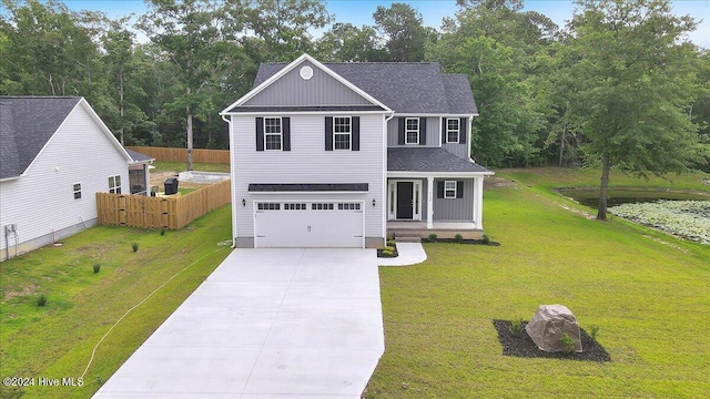 view of front of home with a porch, a front yard, and a garage