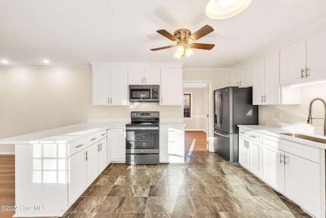 kitchen with white cabinets, stainless steel appliances, and sink