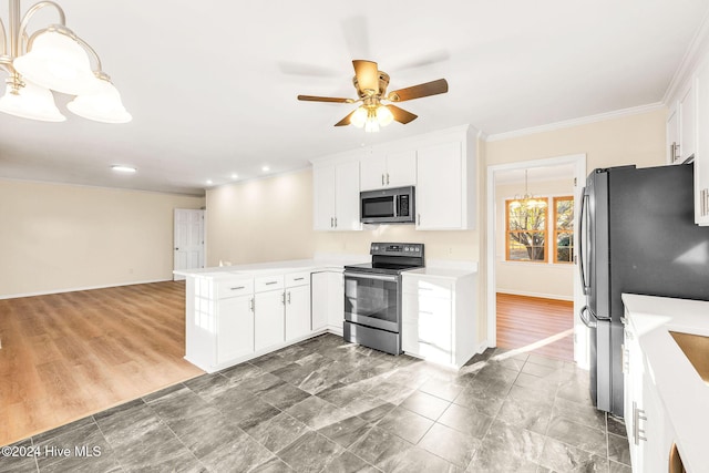 kitchen with white cabinets, dark hardwood / wood-style flooring, kitchen peninsula, and appliances with stainless steel finishes