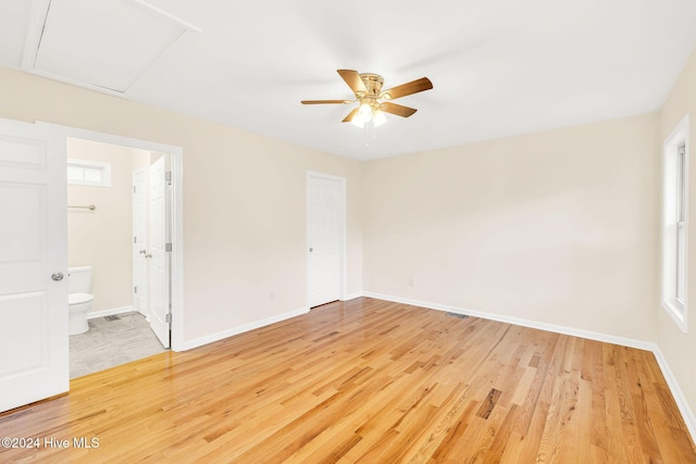 spare room featuring ceiling fan and hardwood / wood-style floors