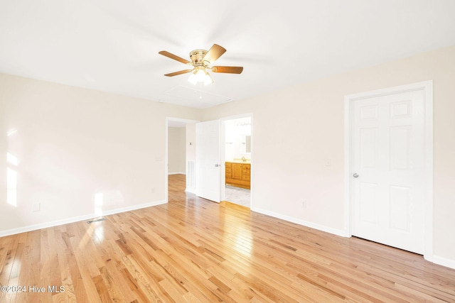 unfurnished room featuring ceiling fan and light hardwood / wood-style floors