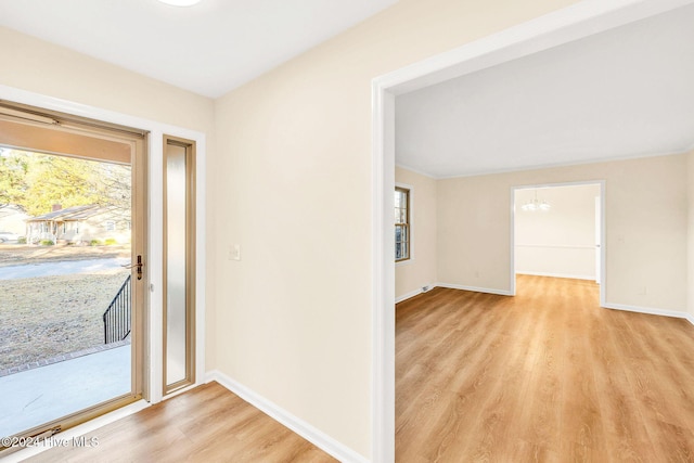 foyer with light hardwood / wood-style floors