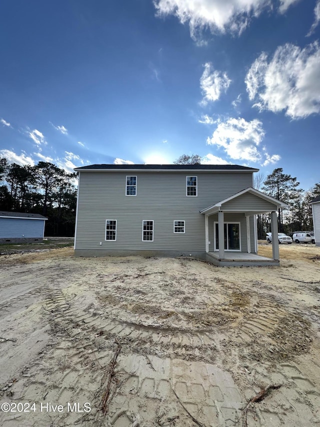 back of house with a patio