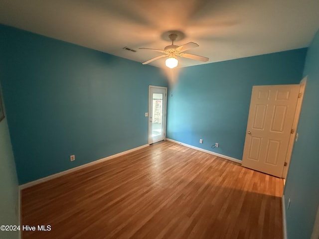 unfurnished bedroom featuring hardwood / wood-style flooring and ceiling fan