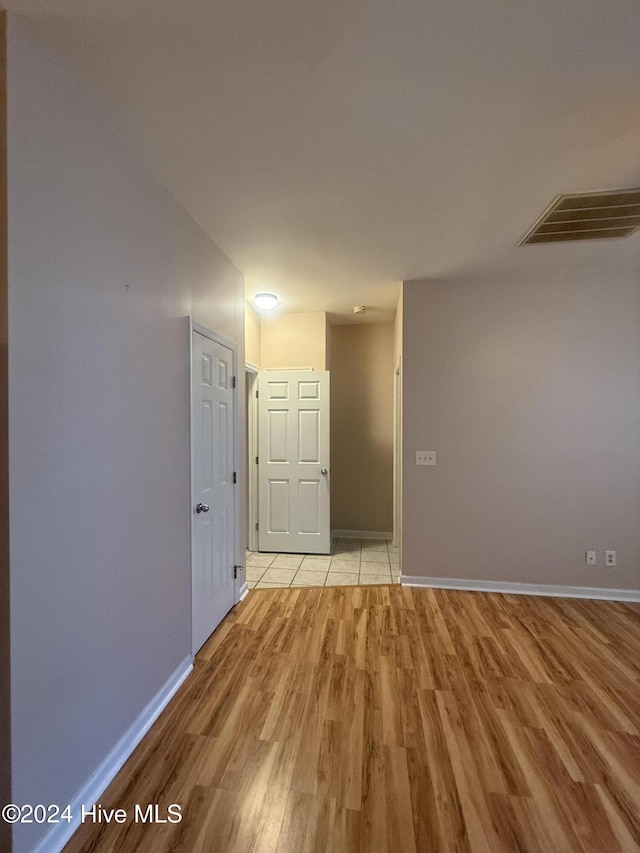 unfurnished room featuring light hardwood / wood-style floors