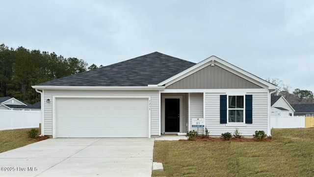 ranch-style home with a garage, concrete driveway, a front yard, and fence